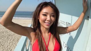 Asian girl in a swimsuit fingering her pussy on the beach tower of the lifeguard