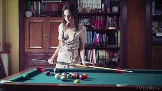 Russian woman dances naked with a cue near a billiard table